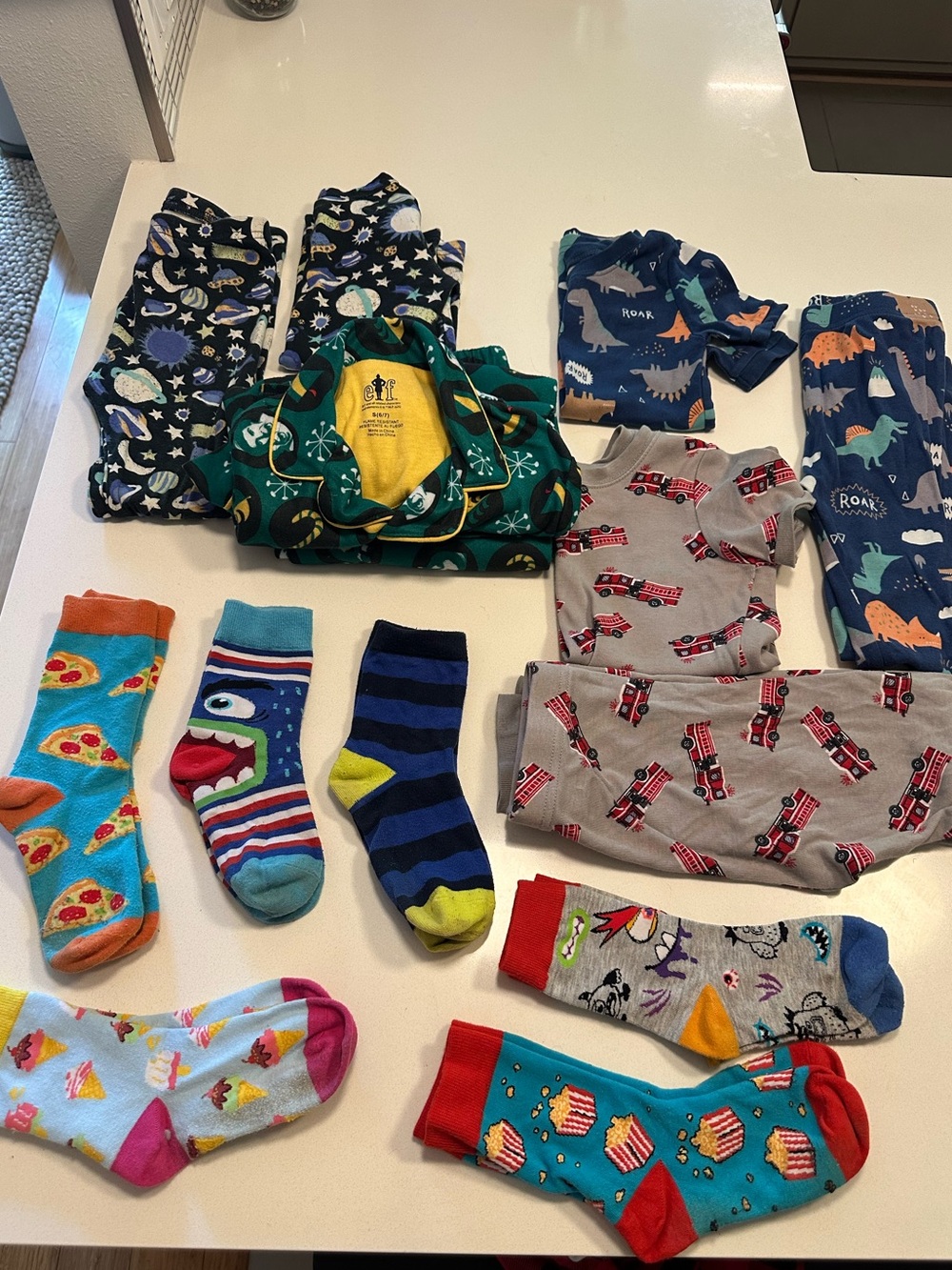 Assorted Kids Pajama Sets and Fun Socks - Dinosaurs, Fire Trucks, Space
